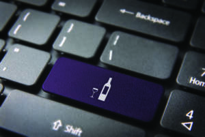 Food key with Wine bottle and cup icon on laptop keyboard. Included clipping path, so you can easily edit it.